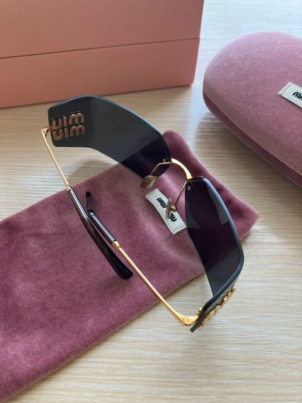 Miu Miu MU54YS Gold Logo Rimless Sunglasses